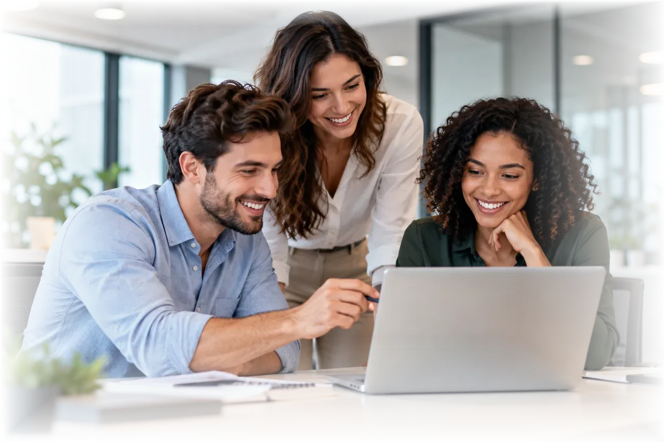 Diverse team collaborating around a laptop in a modern office